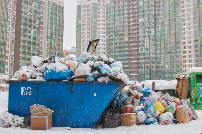 dumpster overflowing with trash