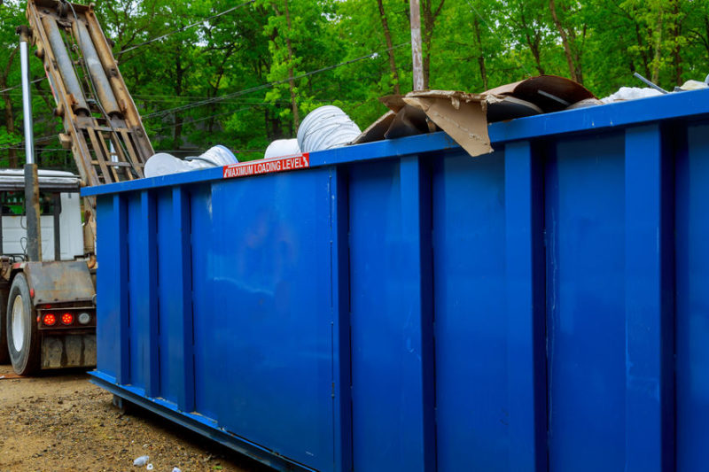 Blue dumpster, recycle waste recycling container trash on ecology and environment