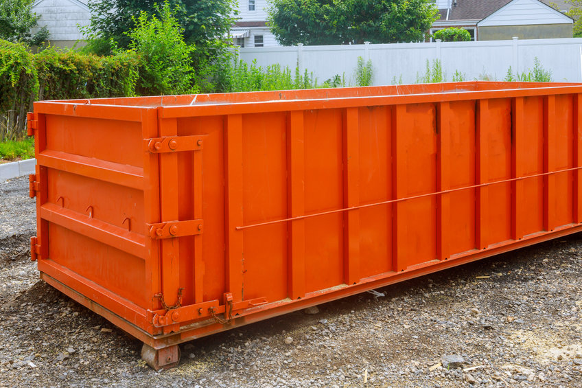 Construction trash dumpsters in an metal container, home house renovation.