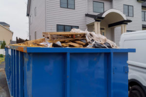 Dumpsters being full with garbage container