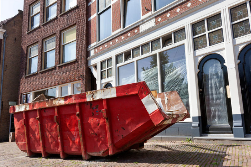 Red skip in a street in Rotterdam