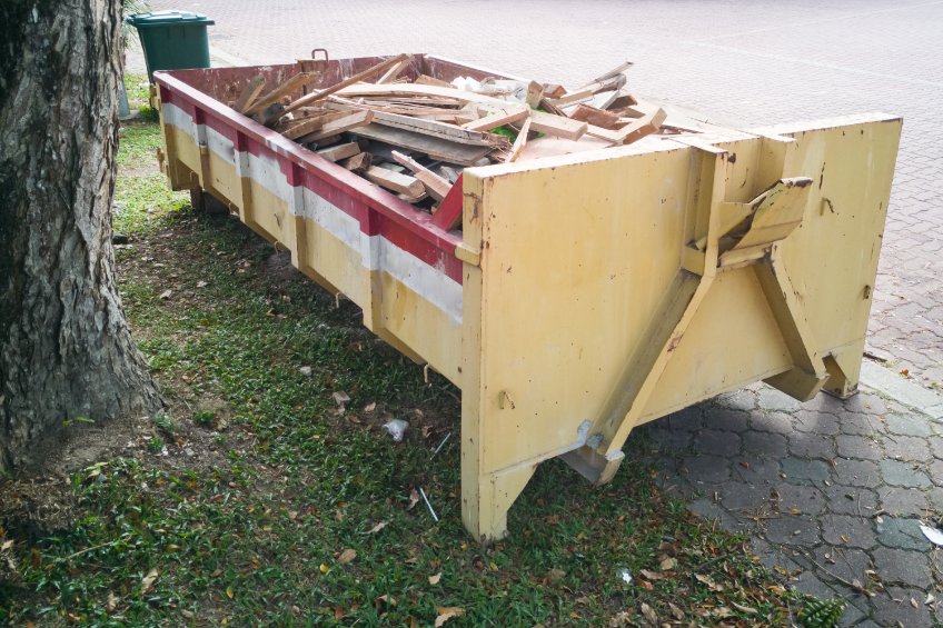 small dumpster filled with construction debris