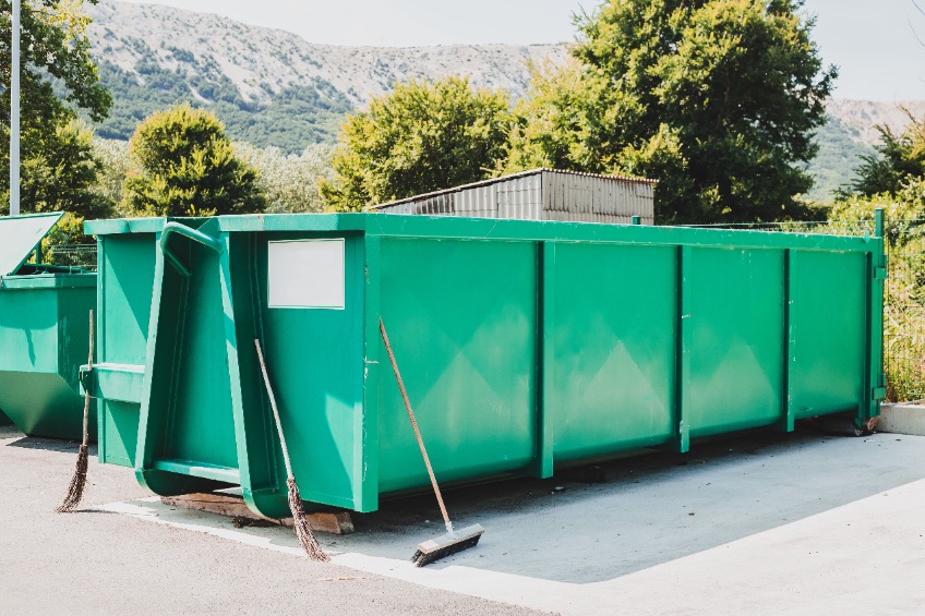 Large green garbage container